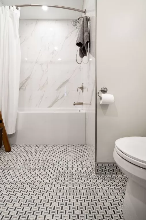 Gorgeous Bathroom with deco-inspired floor tile