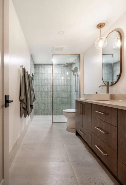 Stunning Ensuite, with Green Shower Walls & Warm Concrete-Look Floor